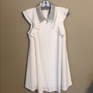 Fabulous white dress with rhinestone collar.